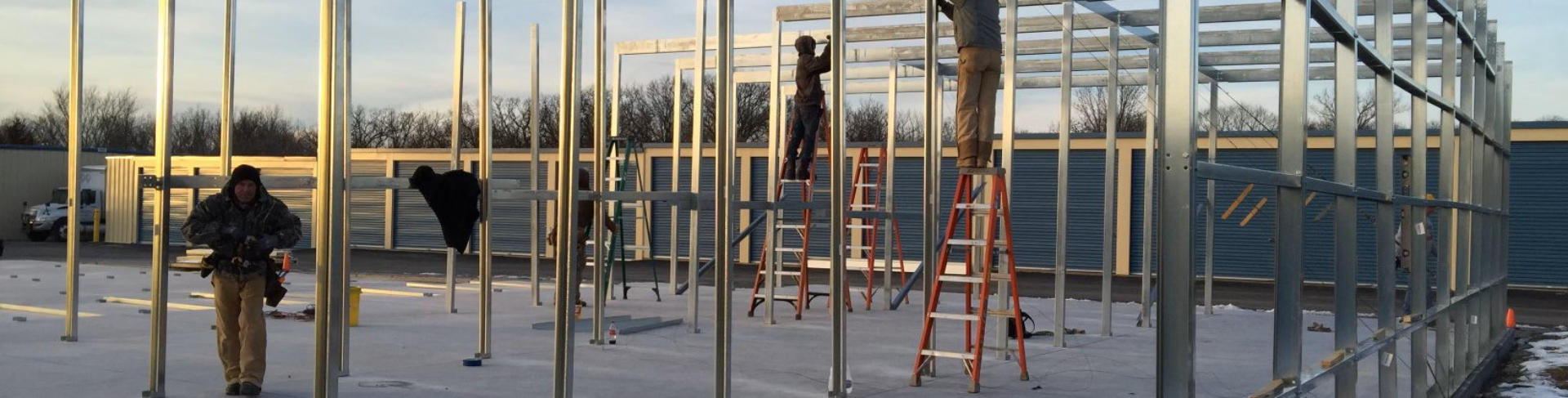 Winter construction site by Silo Steel Buildings: Dedicated workers braving the cold to construct a durable steel storage facility.