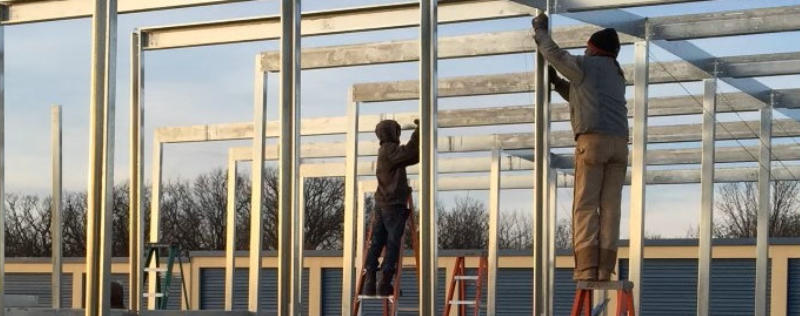 Installing and constructing robust steel beams at a storage unit facility site, showcasing the progress and expertise of Silo Steel Buildings.