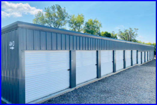 Row of storage units under clear blue skies, showcasing our storage facility on a beautiful day.