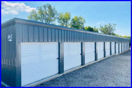 row of storage units under clear blue skies, showcasing our storage facility on a beautiful day.